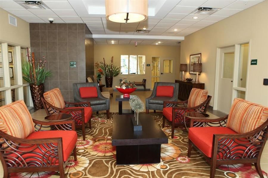 a living room with chairs and a table