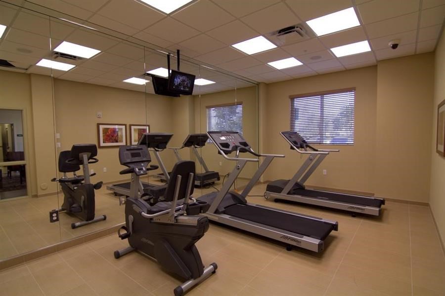 a gym with several pieces of exercise equipment