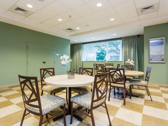 a dining room with tables and chairs