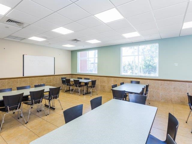 a large room with tables and chairs in it