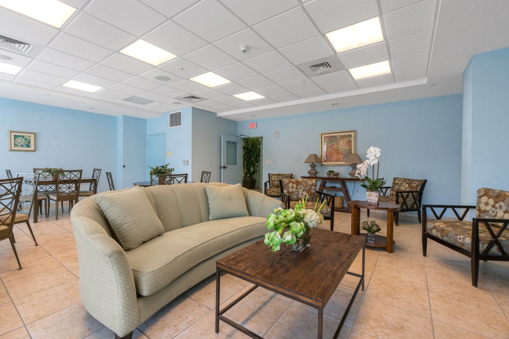 a living room with a couch and tables