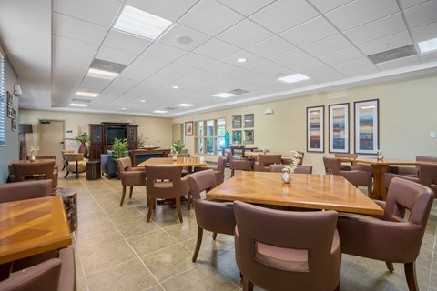 a dining room with tables and chairs in a restaurant