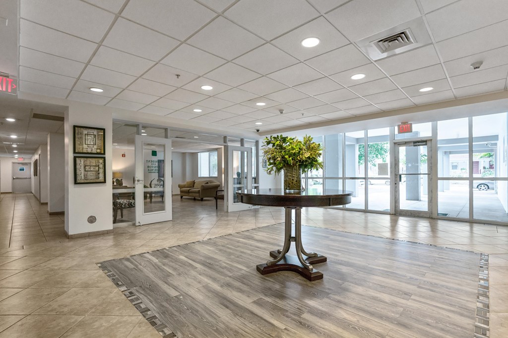 a large lobby with a table in the middle of it