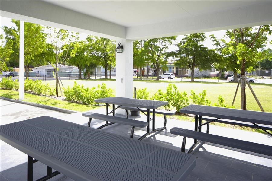 a group of picnic tables on a patio