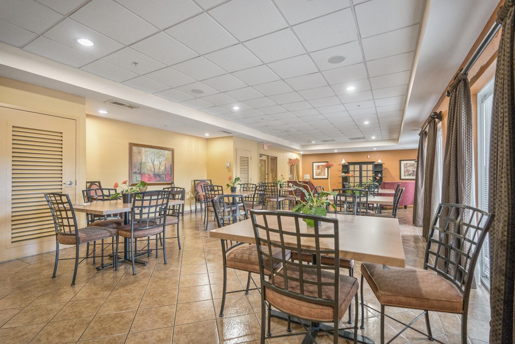 a dining room with tables and chairs in a restaurant