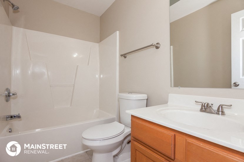 a bathroom with a sink toilet and a shower