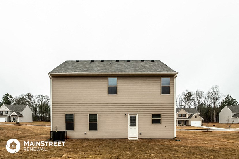 the view of the front of the house from the field