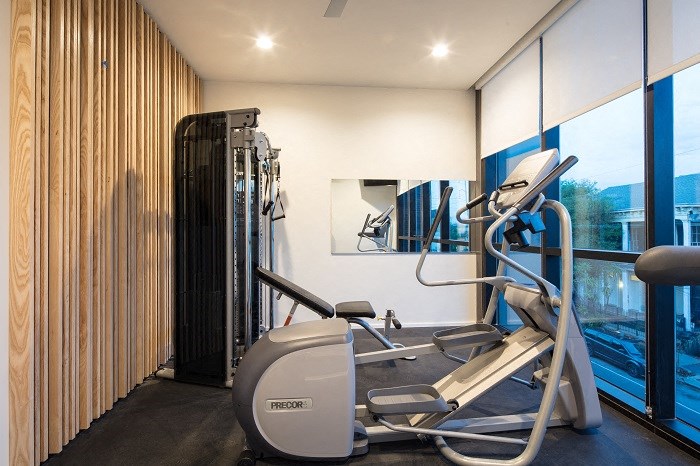 a gym with a large window and a workout machine