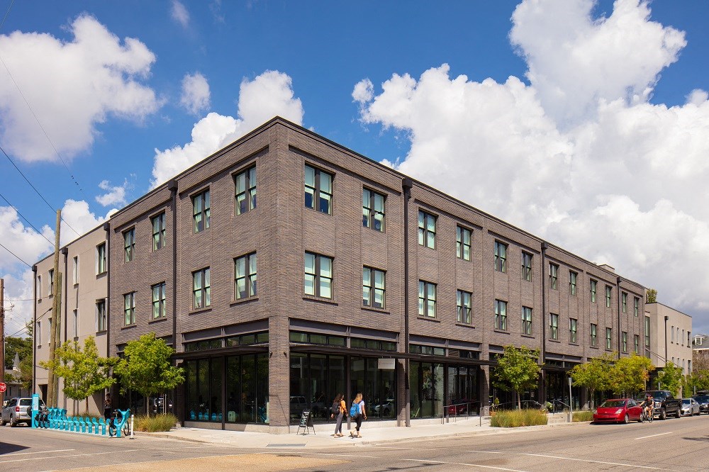 a brick building on the corner of a city street