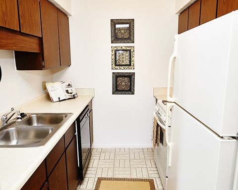 a kitchen with a sink and a refrigerator