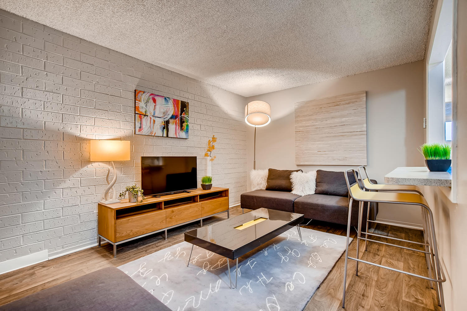 a living room with a couch and a table