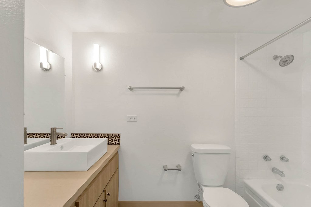 a bathroom with a sink toilet and a shower