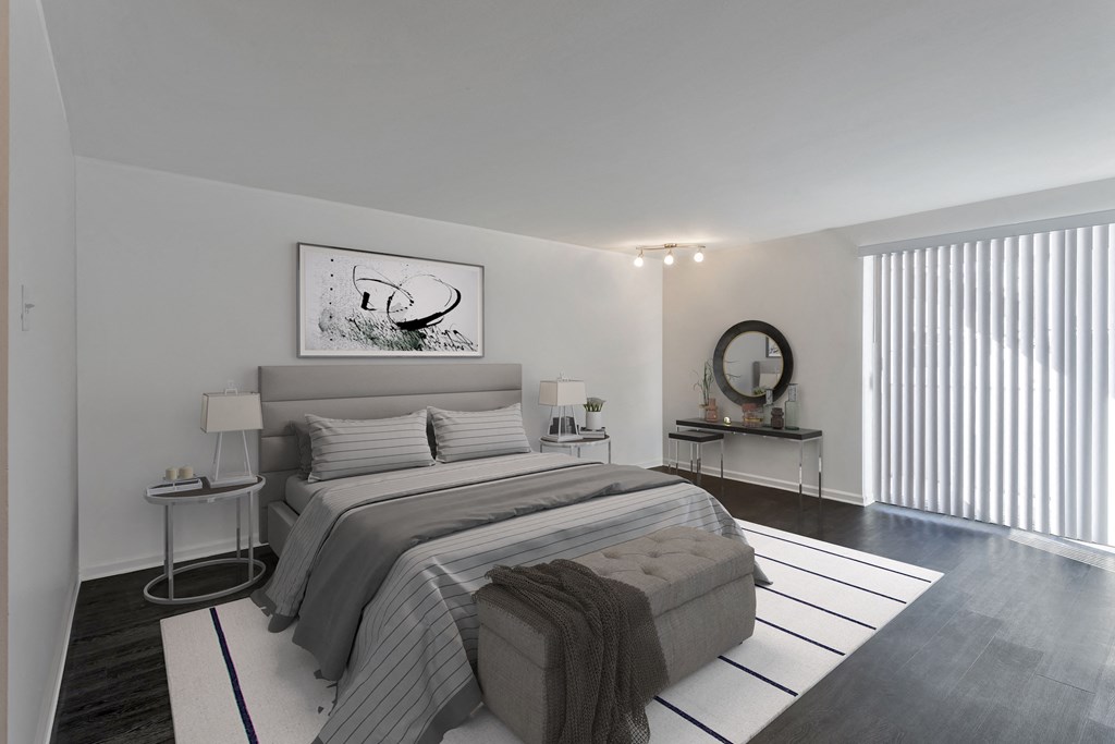 a bedroom with a large bed and a large window