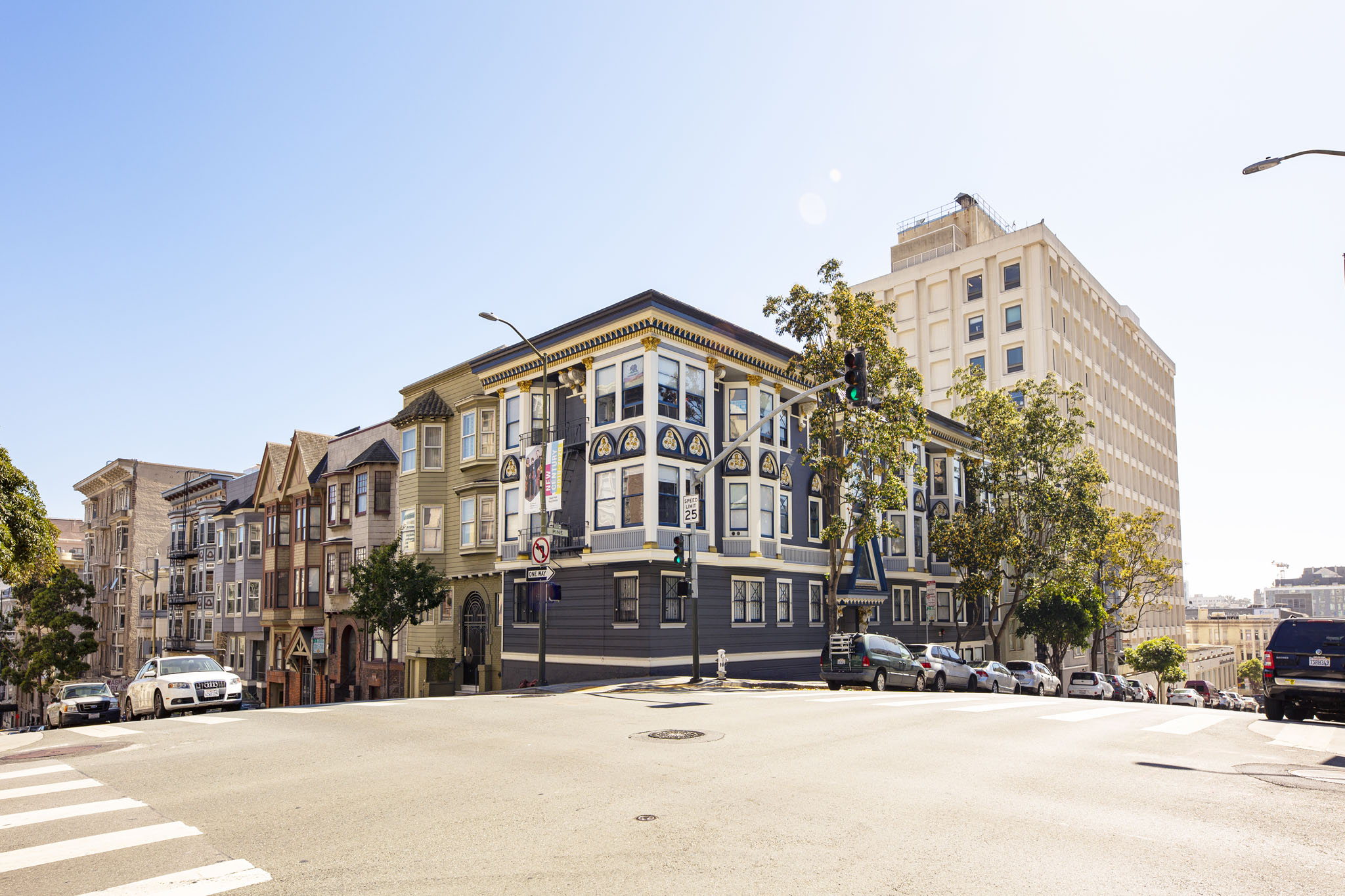 A row of colorful buildings line a city street.