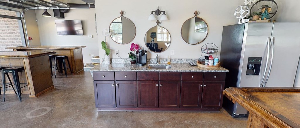 a kitchen with a counter top and a refrigerator