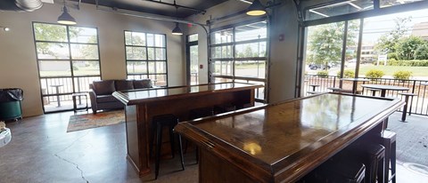 an empty bar in a room with a pool table