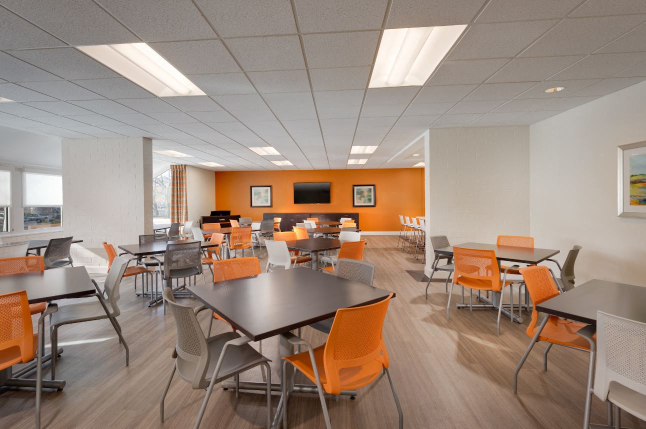 a dining room with tables and chairs