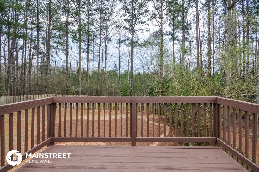the deck has a view of the woods