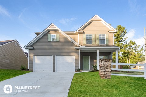 a tan and with two garage doors