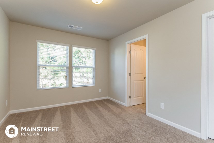 the master bedroom is spacious and has a door to the ensuite bathroom