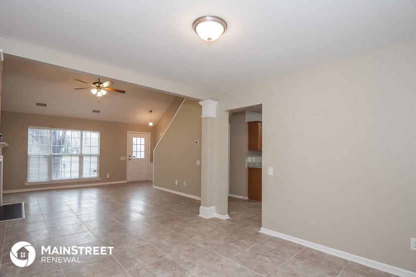 the spacious living room and dining room are open to the kitchen