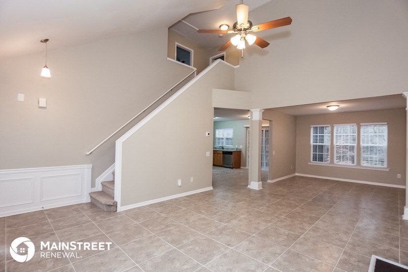 the living room and dining room are open to the kitchen
