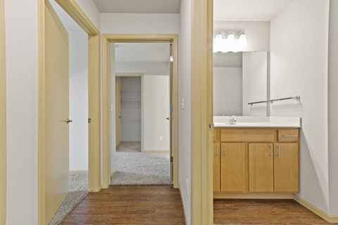 an empty bathroom with a sink and a mirror