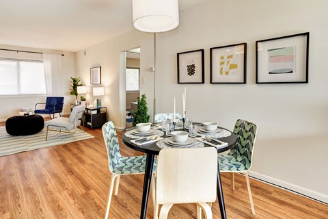 a dining room with a table and chairs