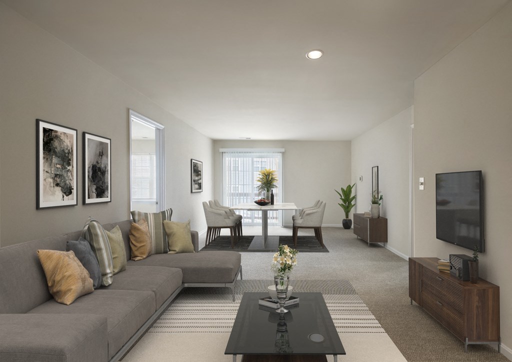 Living room with couch at The Apartments at Owings Run, Maryland, 21117
