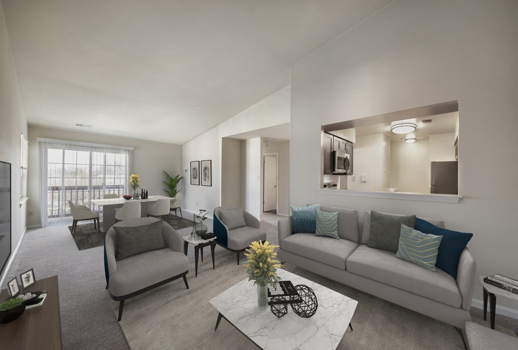 a living room with couches and chairs and a table