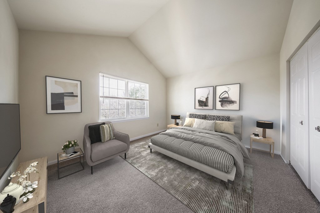 a bedroom with a bed and a chair and a window