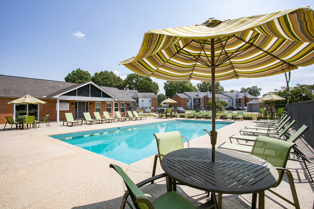 our apartments offer a swimming pool with tables and chairs