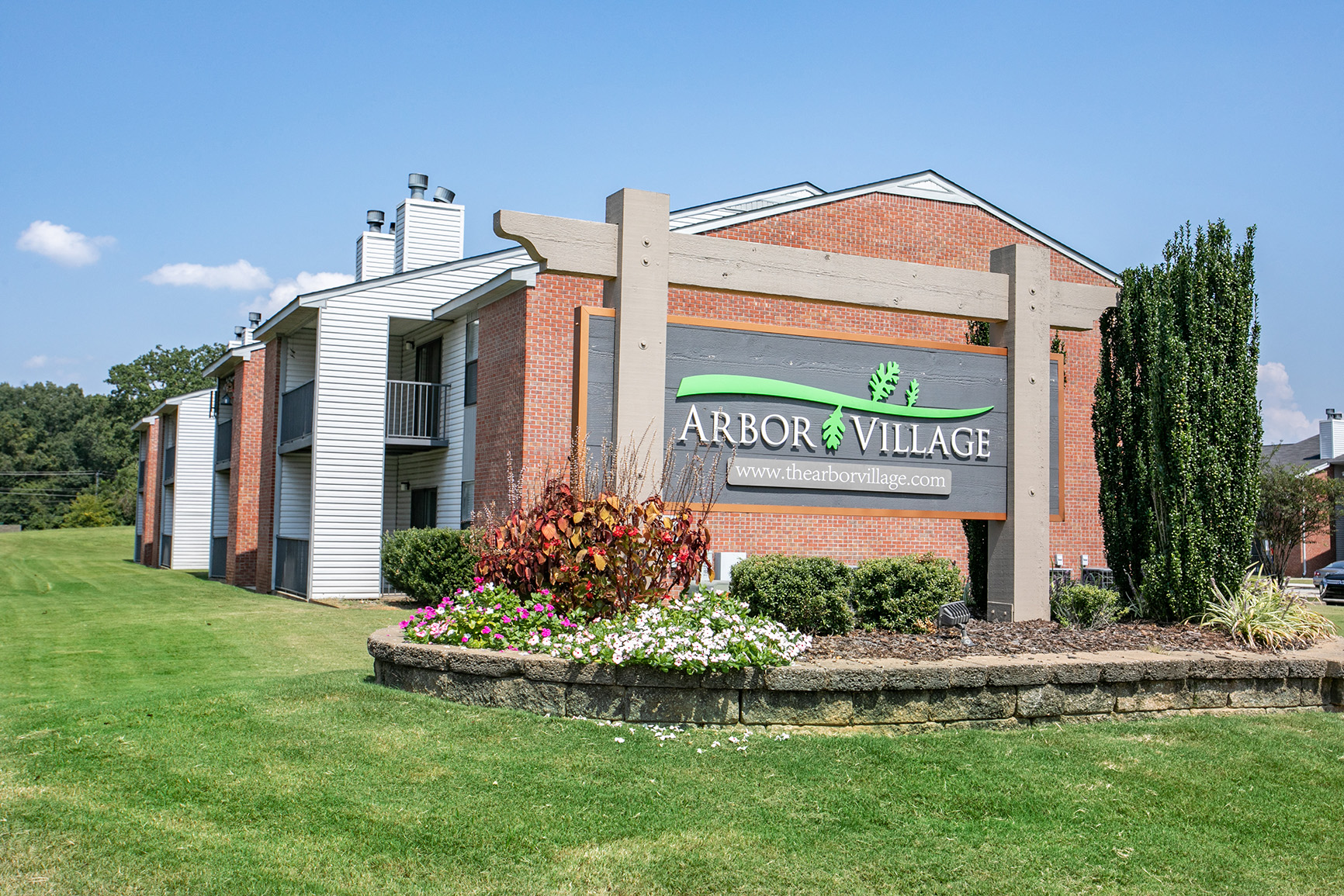 sign in front of a brick building
