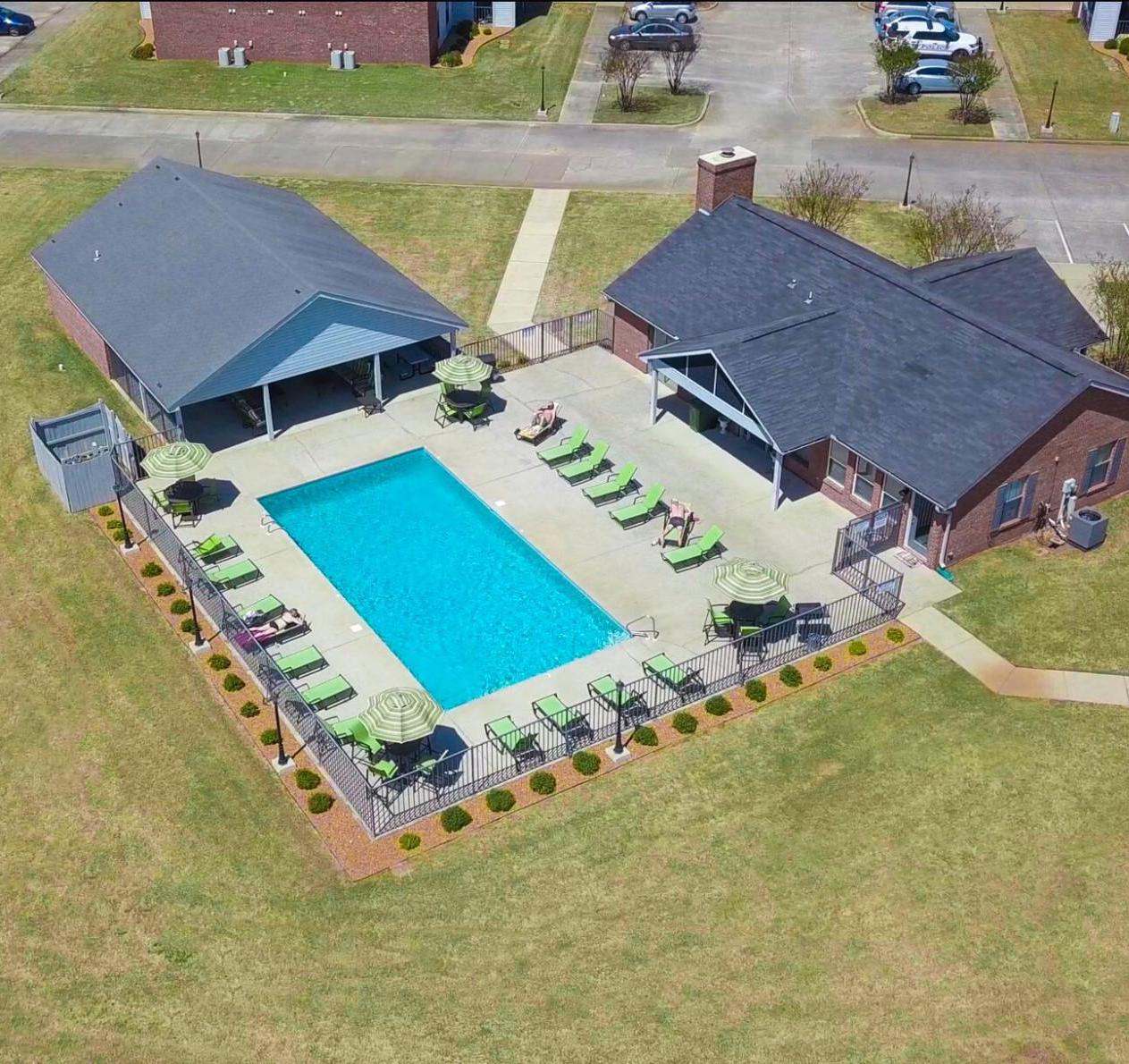an aerial view of a house with a swimming pool