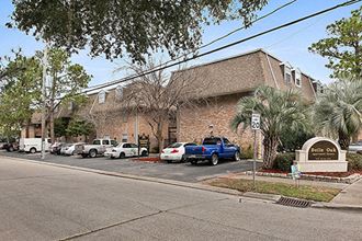 a building with cars parked in front of it