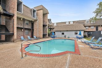 our apartments have a large pool and lounge chairs