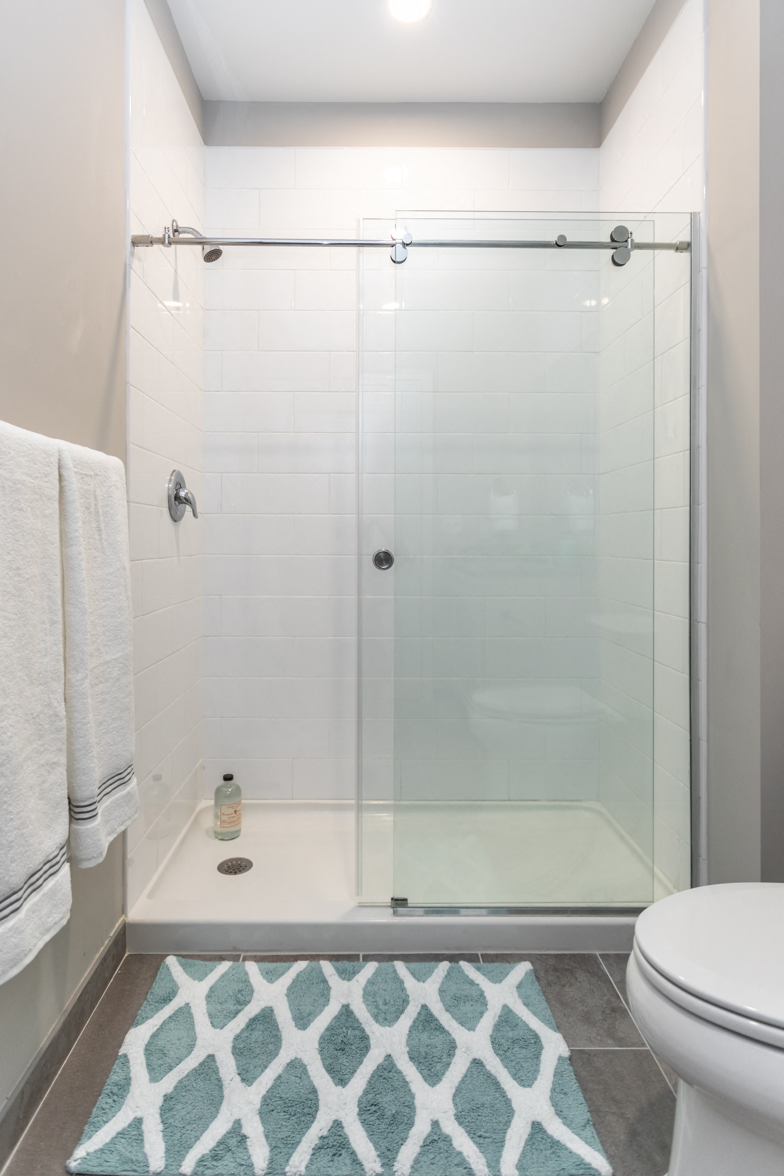 Gorgeous walk-in shower with white tile and glass doors in Bala Cynwyd apartment for rent
