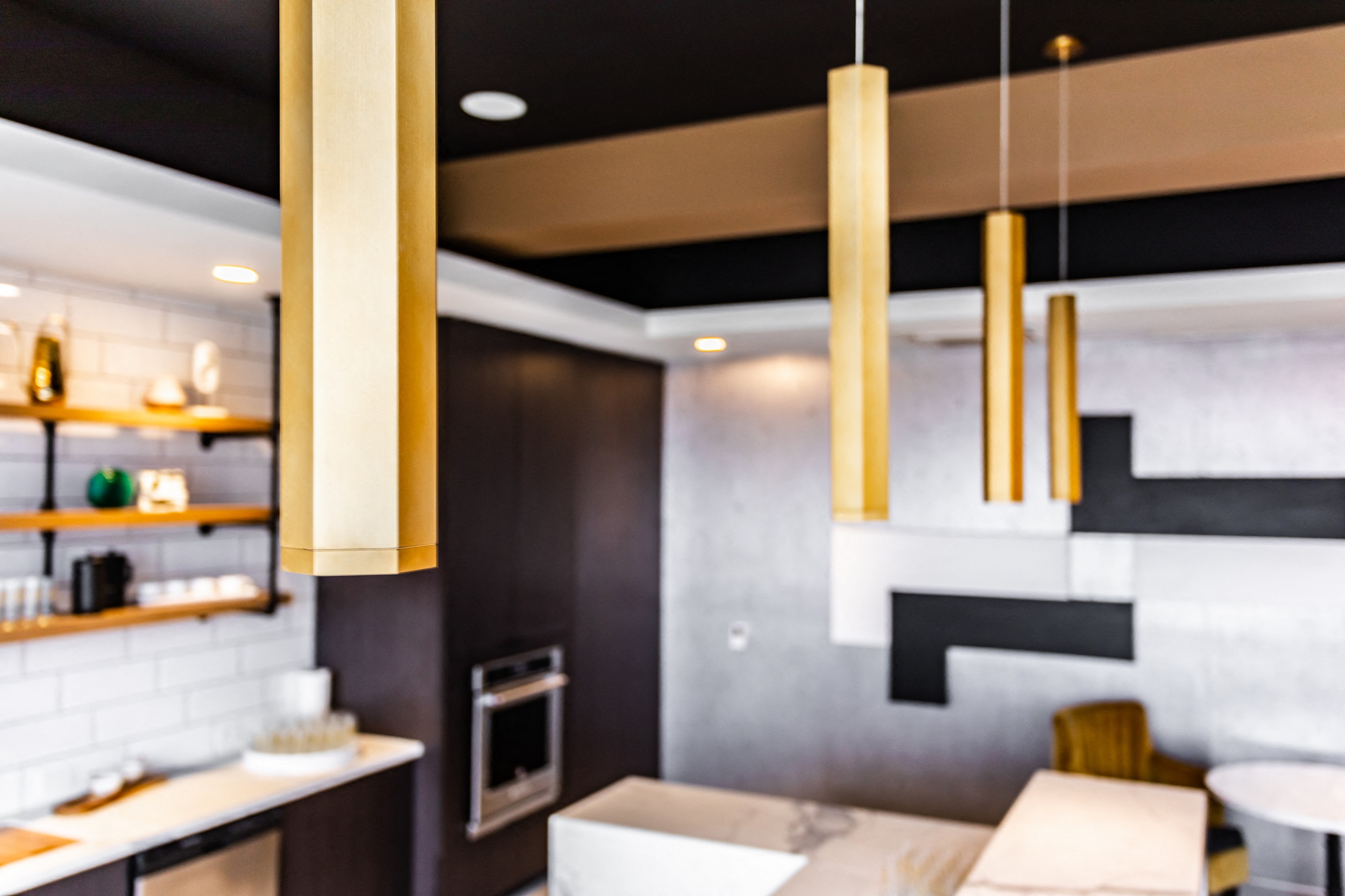 Contemporary lighting fixtures above bar for residents of the Kelly Apartments in Bala Cynwyd, PA
