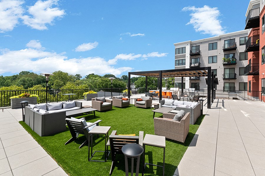 Outdoor grass area at The Kelly with plenty of seating areas plus a grill