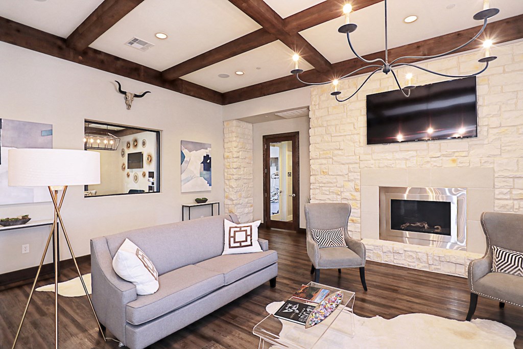 a living room with a couch and a fireplace