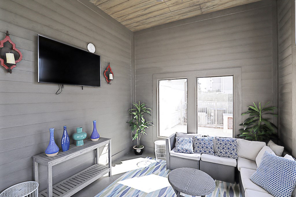 a living room with a couch and a television