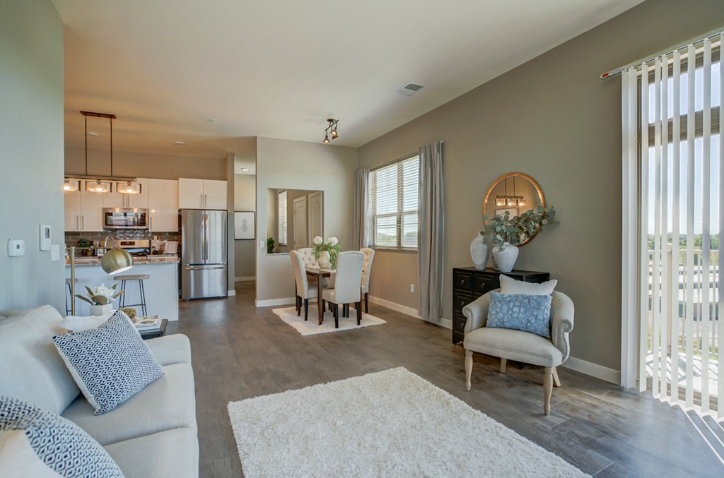a living room with a dining room and a kitchen