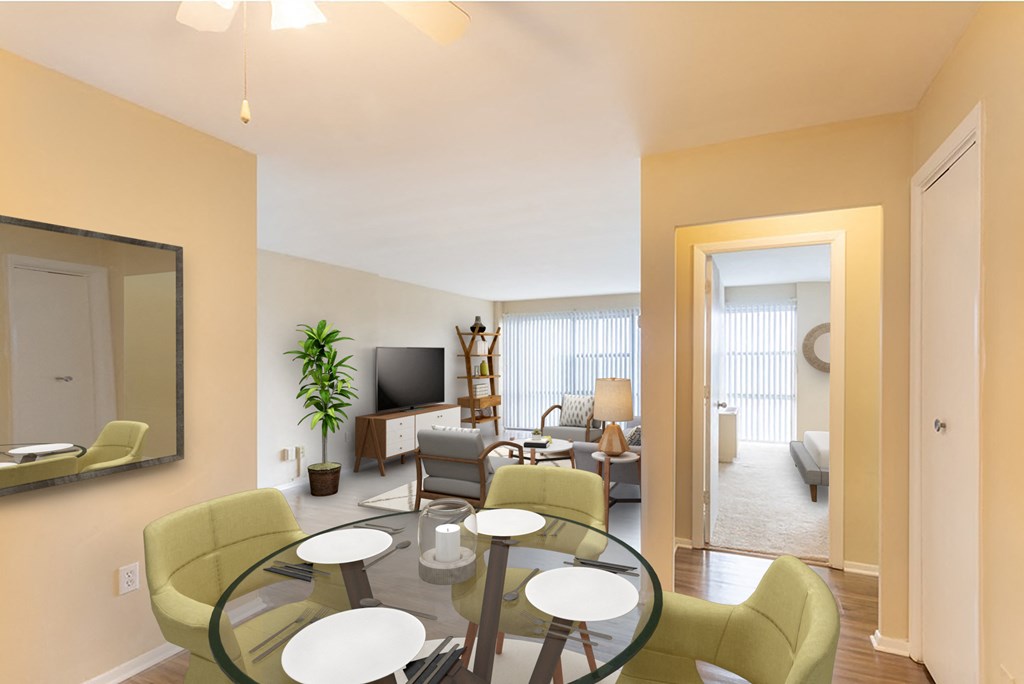 a living room with a glass table and a dining room