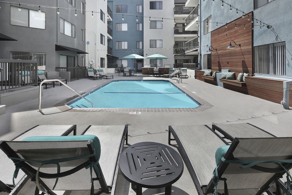 a swimming pool in the middle of an apartment building