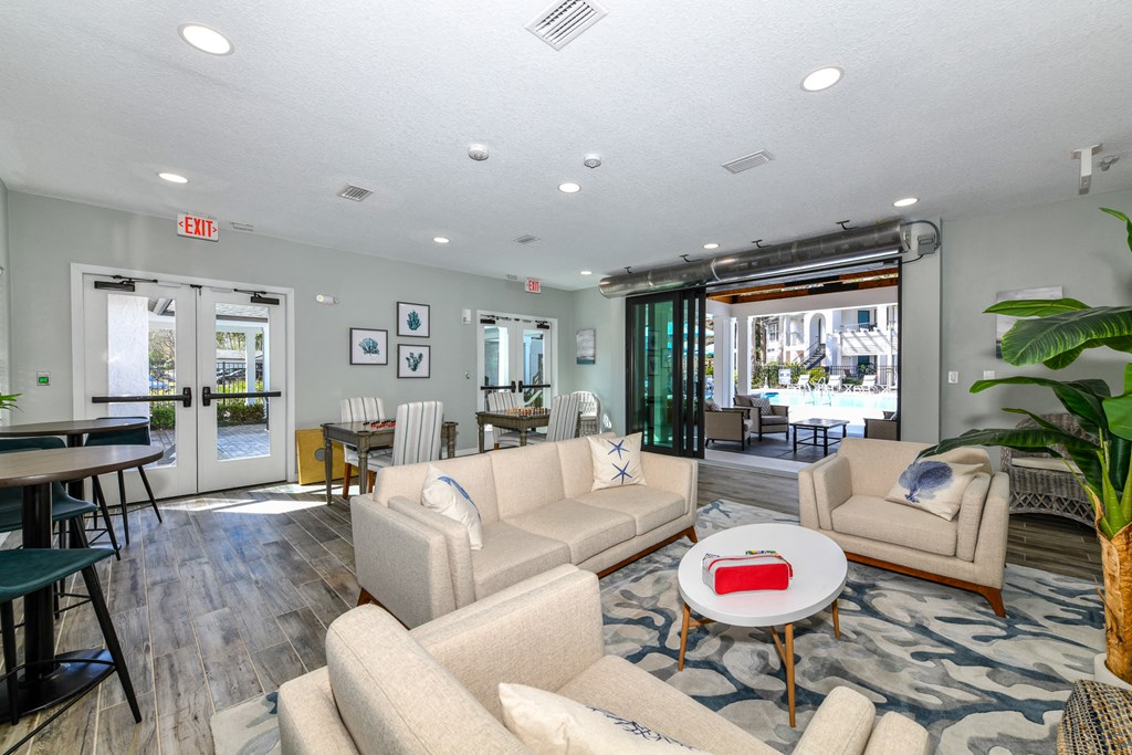 a living room with couches and chairs and a table
