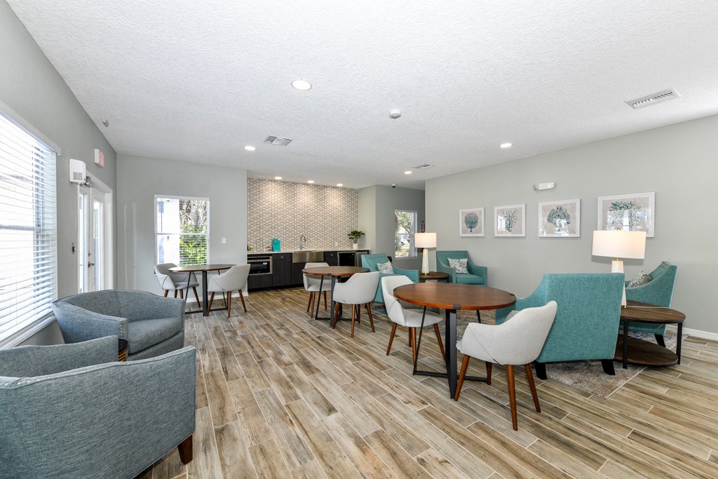 a living room with couches and chairs and a table