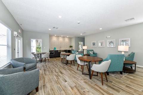 a living room with couches and chairs and a table