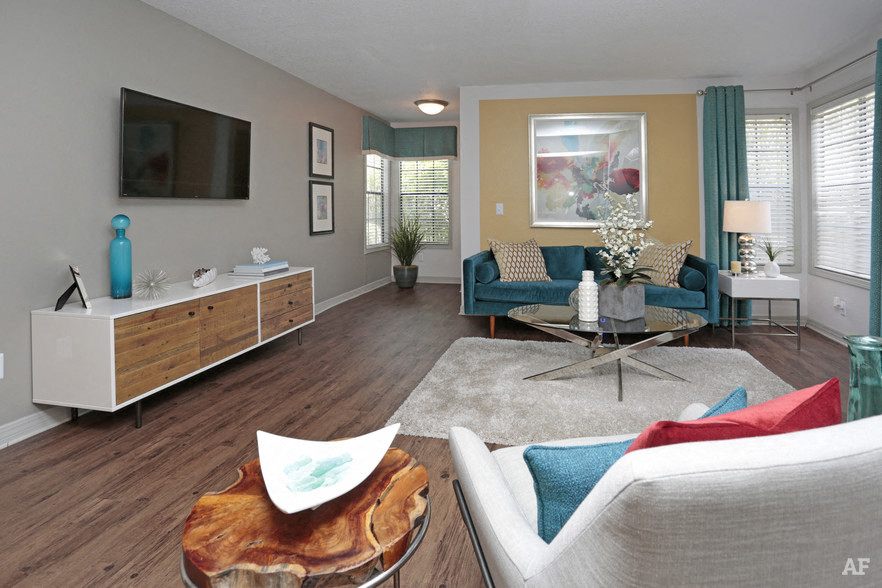 a living room with a couch and a tv