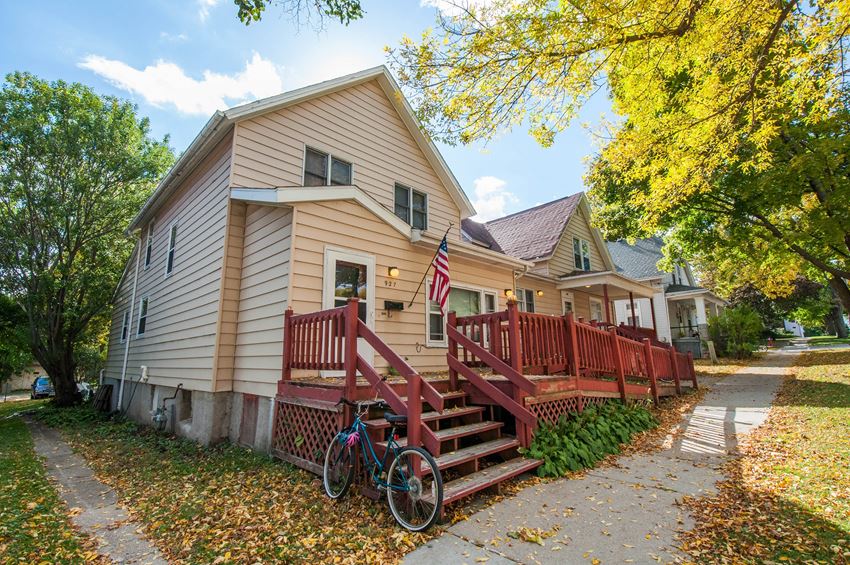 a house with a porch and a bike parked in front of it