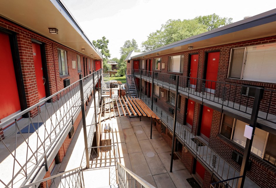 a view of the courtyard of an apartment building from a balcony